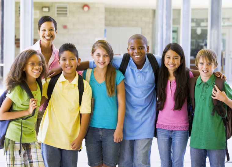 teacher standing with with her middle school students