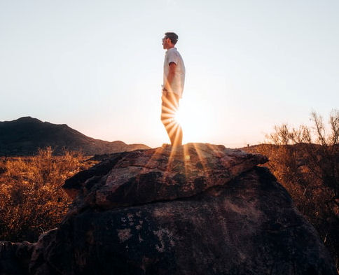 man standing on a rock